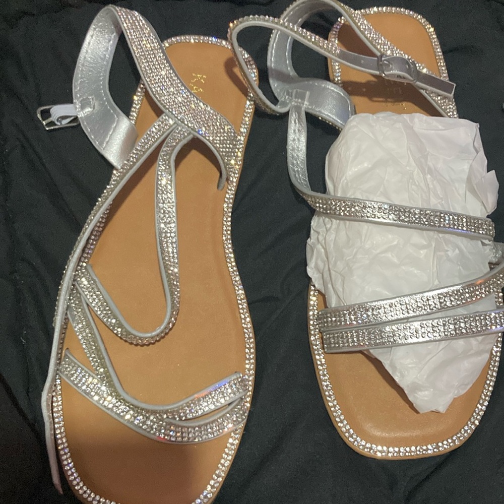 2 pair of sandal one is silver and one is rose gold one is a size ten and a 9